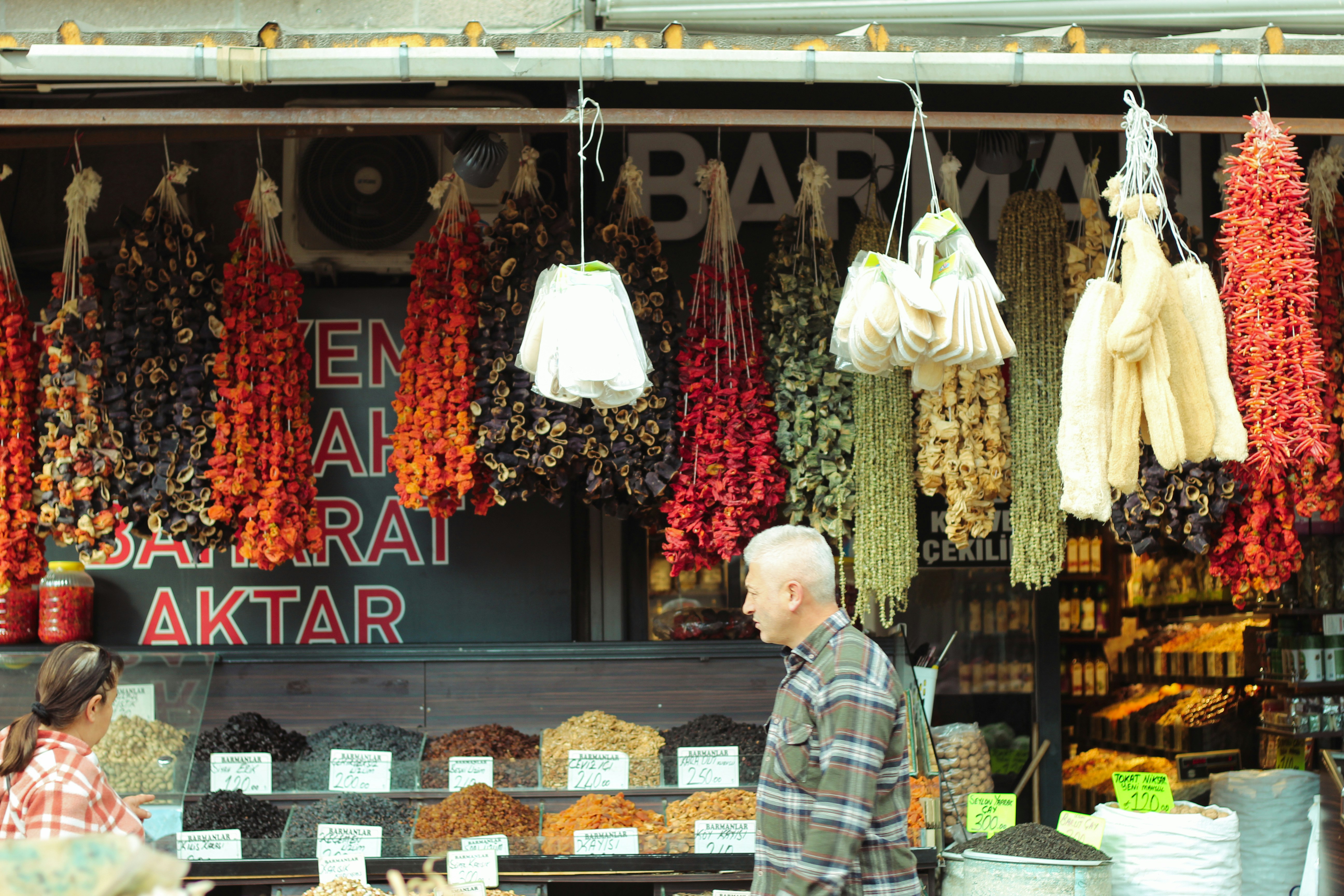 a man and a woman standing in front of a store