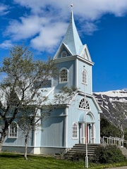 a church with a steeple and a steeple on the side of it