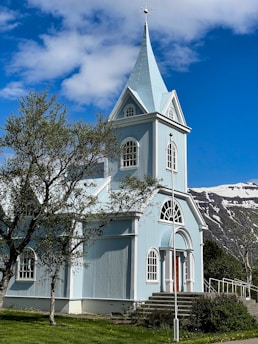 a church with a steeple and a steeple on the side of it