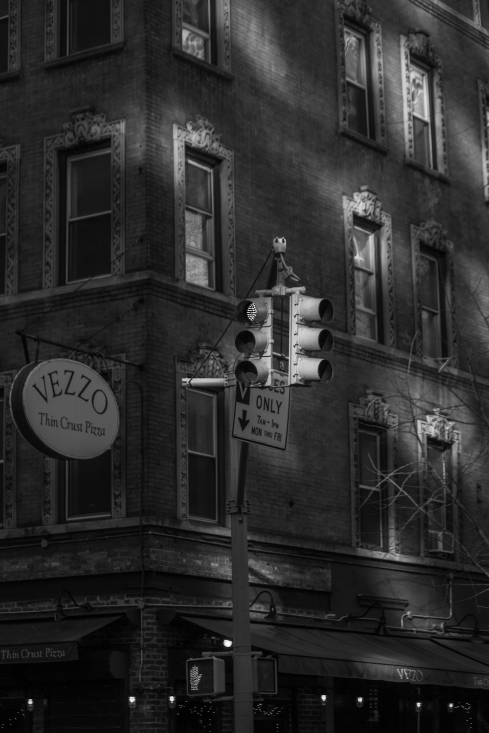 a black and white photo of a building at night