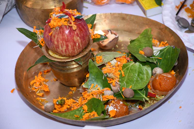 Close-up of sacred samagri items arranged neatly on a brass plate ready for a havan.