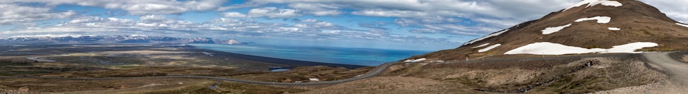 a mountain with a winding road going through it