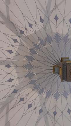 Close-up of a multilayered mandala wall art piece in warm pine wood tones.