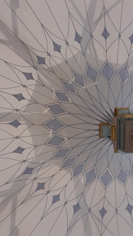 Close-up of sacred geometry patterns used in vastu design on a wall panel.