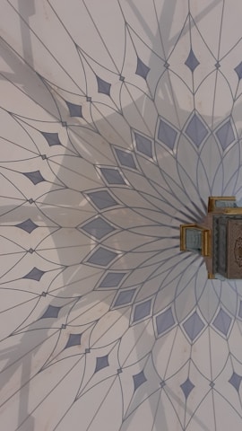 Close-up of colorful chakra-inspired details on minimalist white walls.