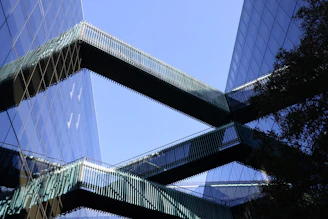 Modern office building with interconnected glass corridors symbolizing integrated business operations.