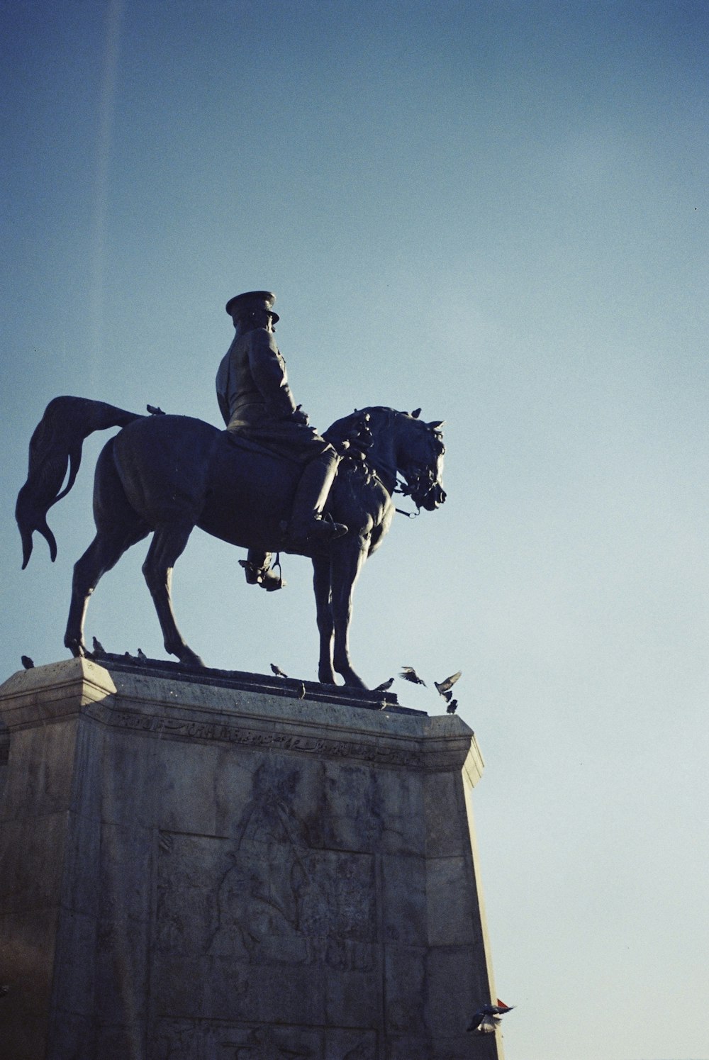 a statue of a man riding a horse