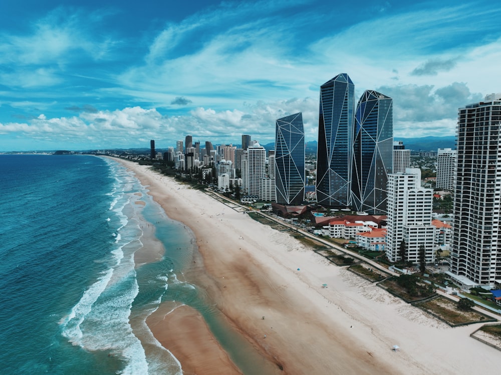 an aerial view of a beach and a city