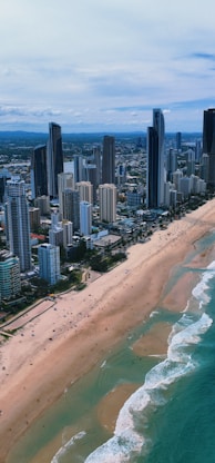 an aerial view of a beach and a city
