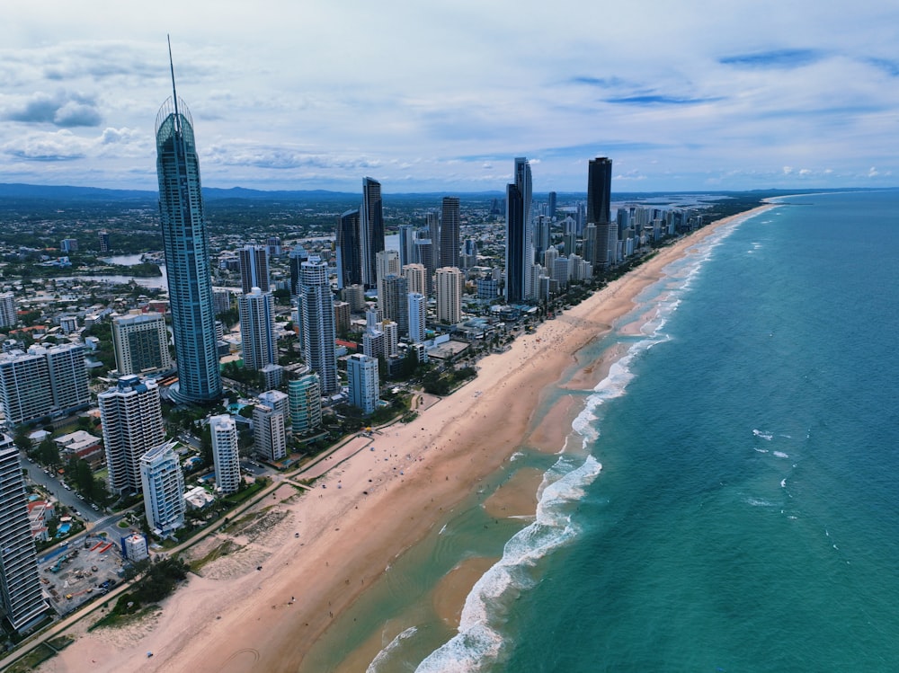 an aerial view of a beach and a city