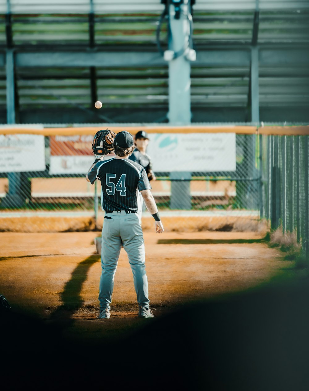 a group of baseball players standing on top of a field