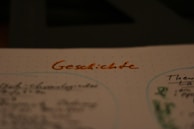 A close-up of a student practicing German writing.