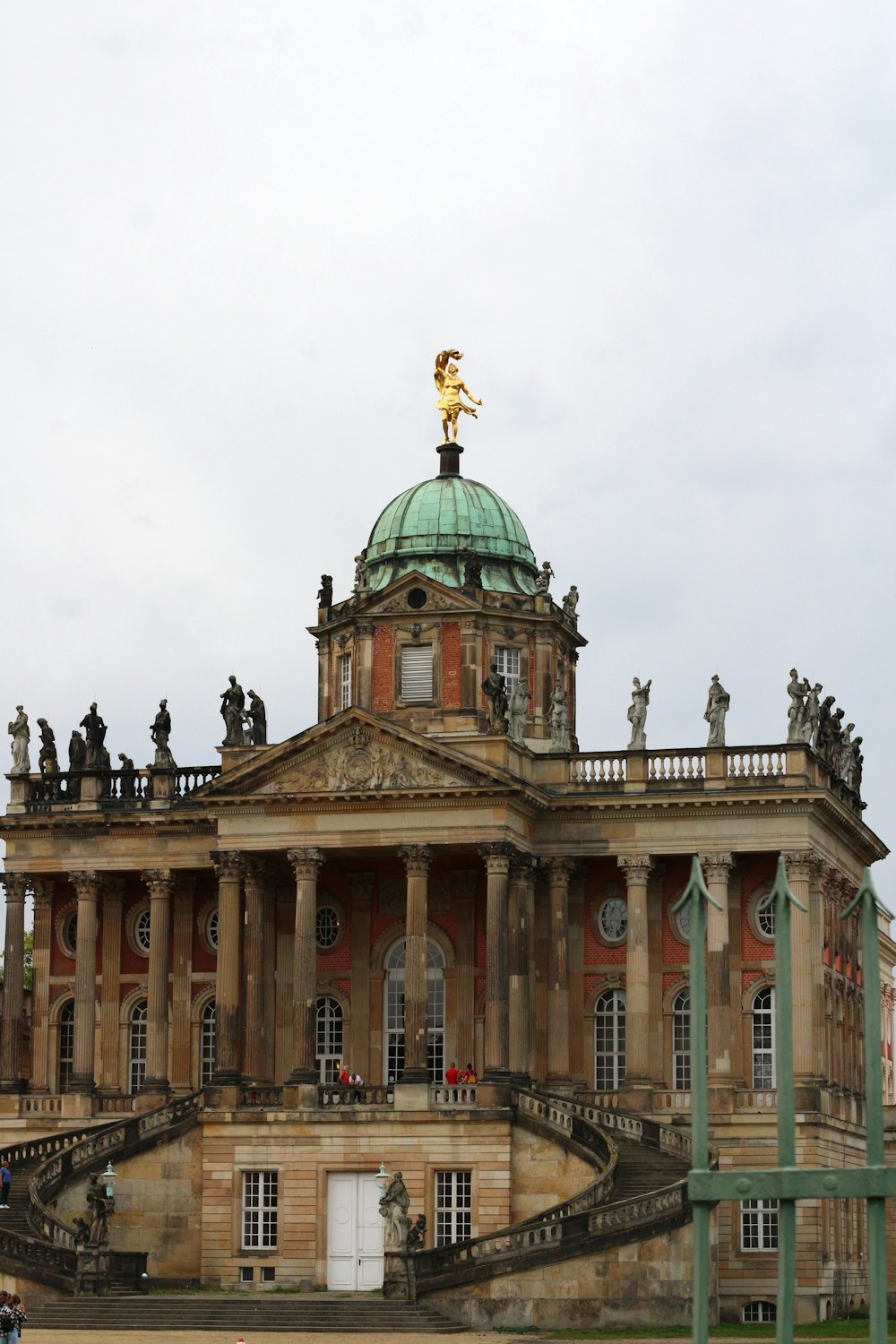 a large building with a green dome on top of it