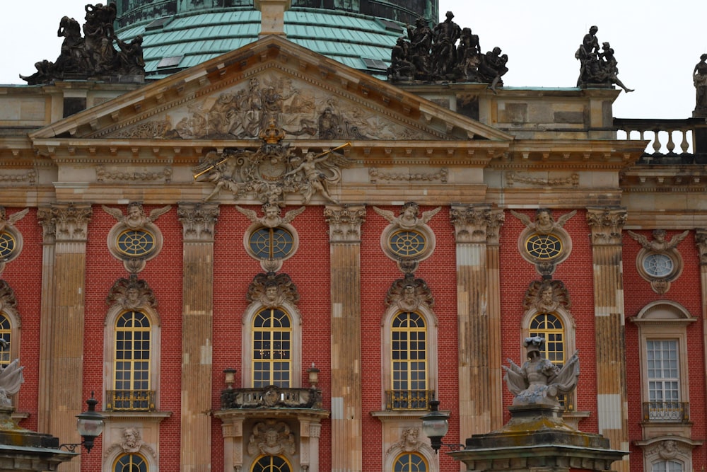 a large building with statues on the front of it