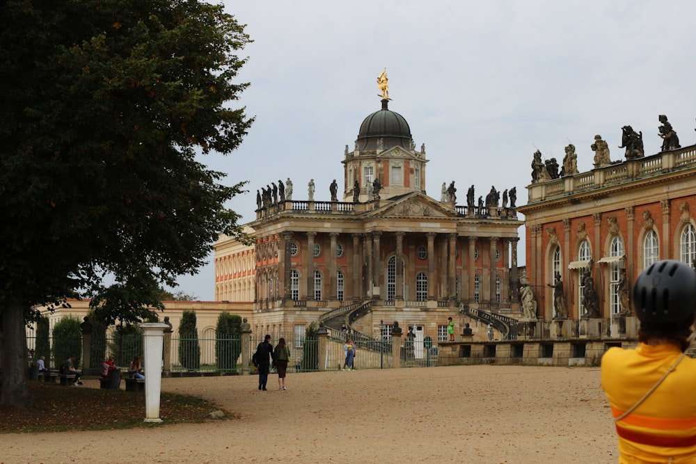 a person taking a picture of a large building