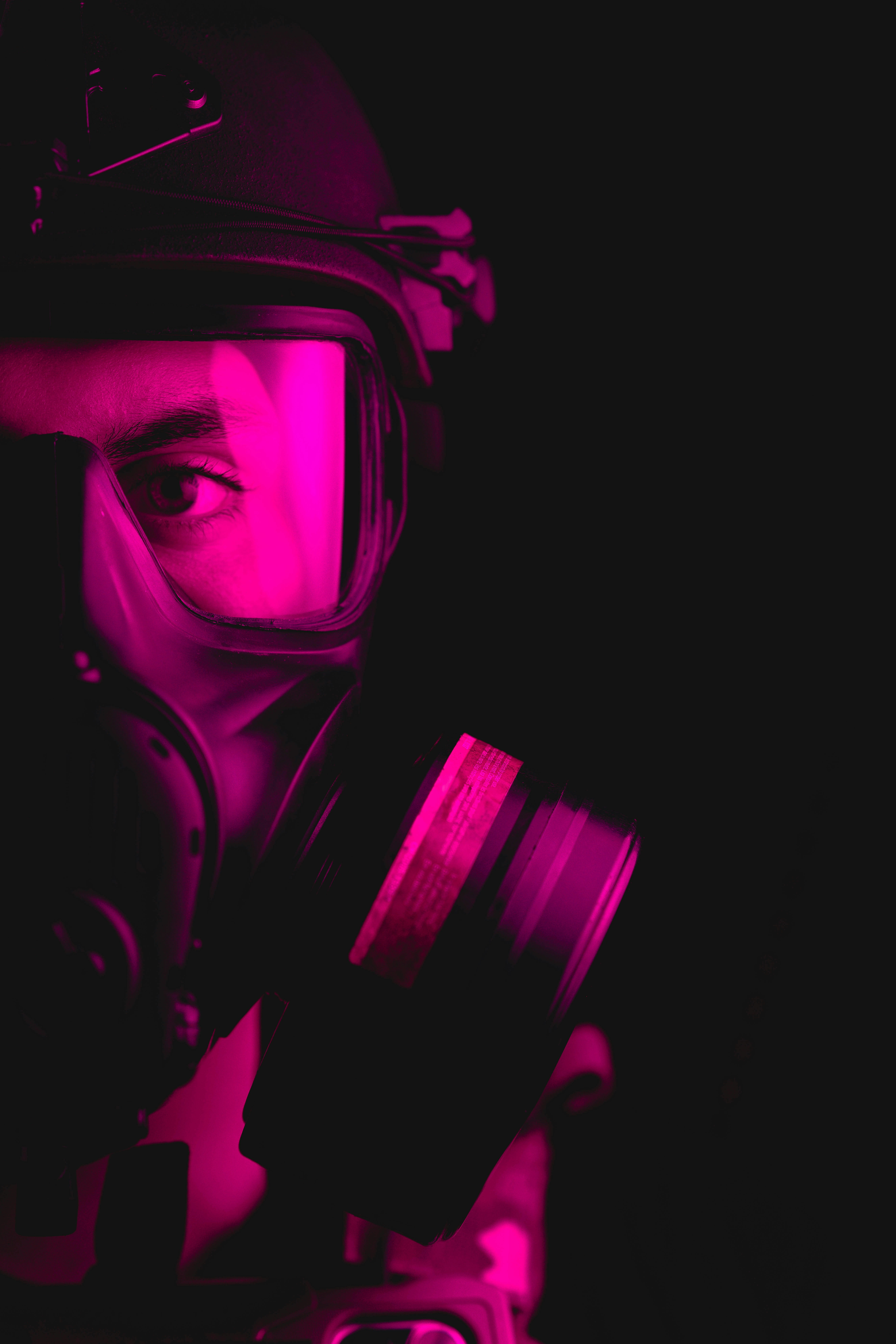 a man wearing a gas mask and holding a camera