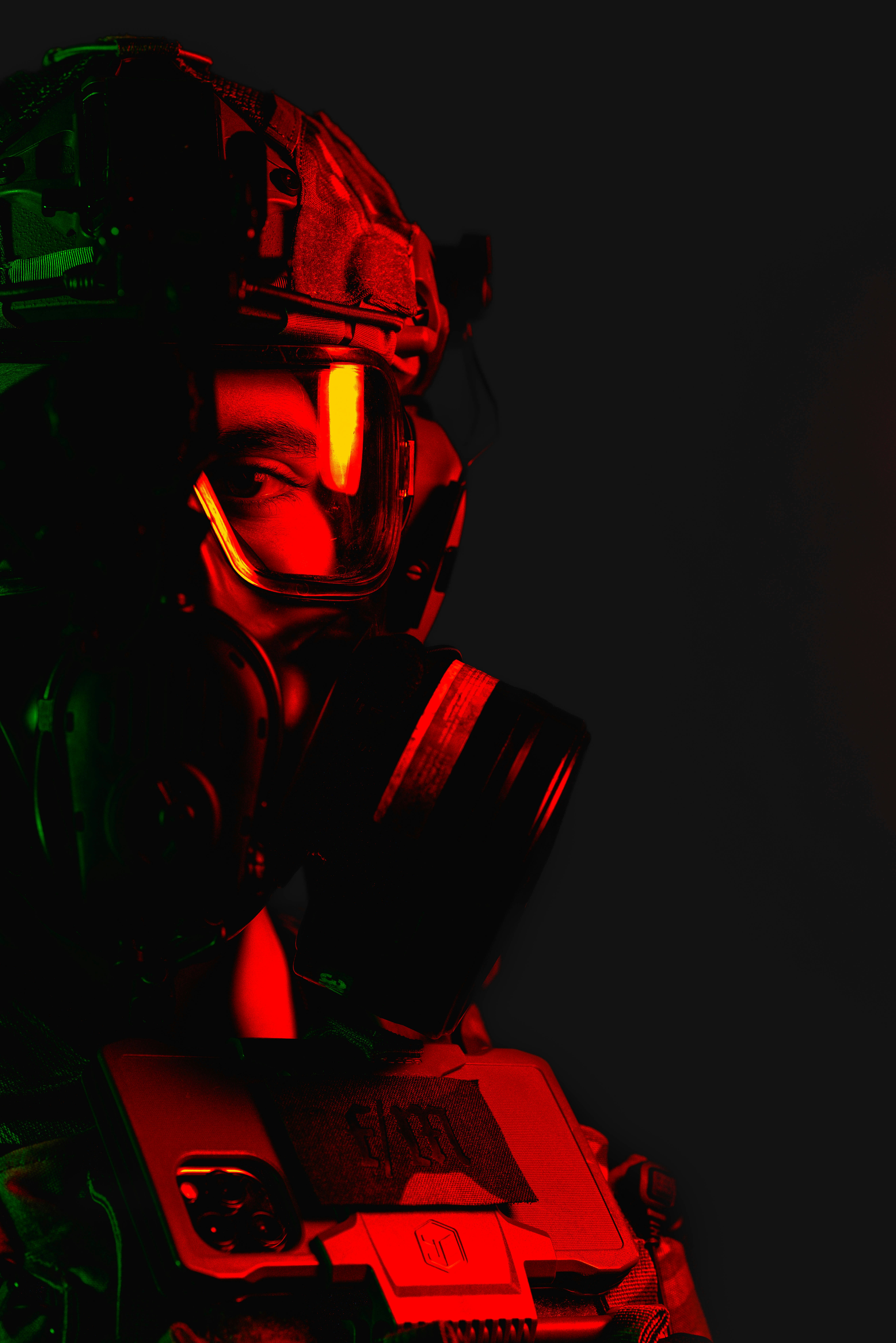 a man wearing a gas mask and a red light