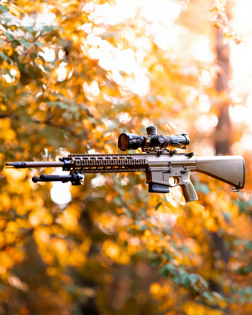 a rifle with a scope attached to it