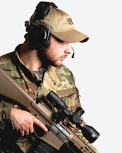 A friendly airsoft player holding a radio, ready to communicate.