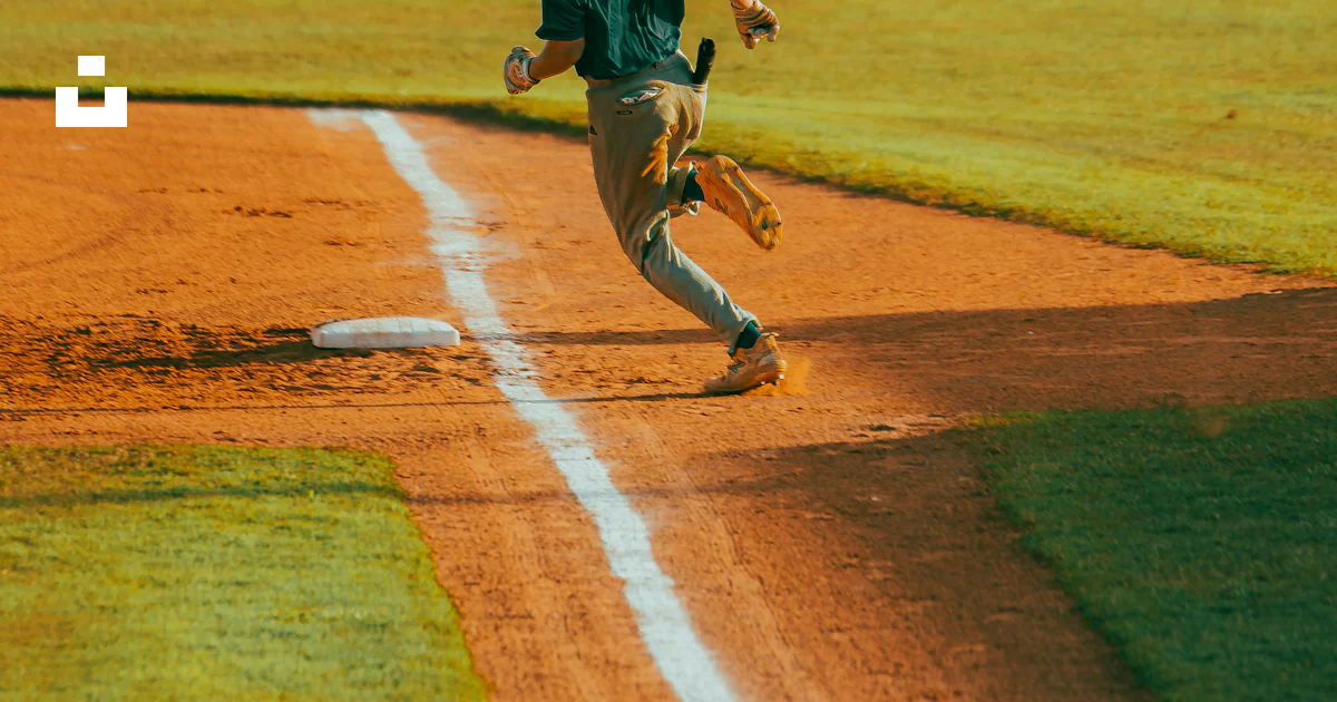 A baseball player running across a baseball field photo – Free Baseball ...