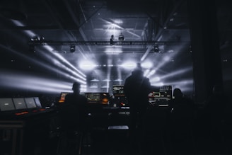 a group of people standing in front of a stage