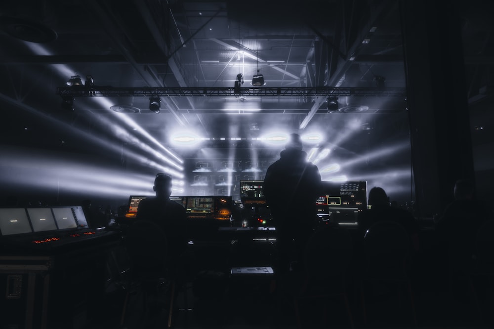 a group of people standing in front of a stage