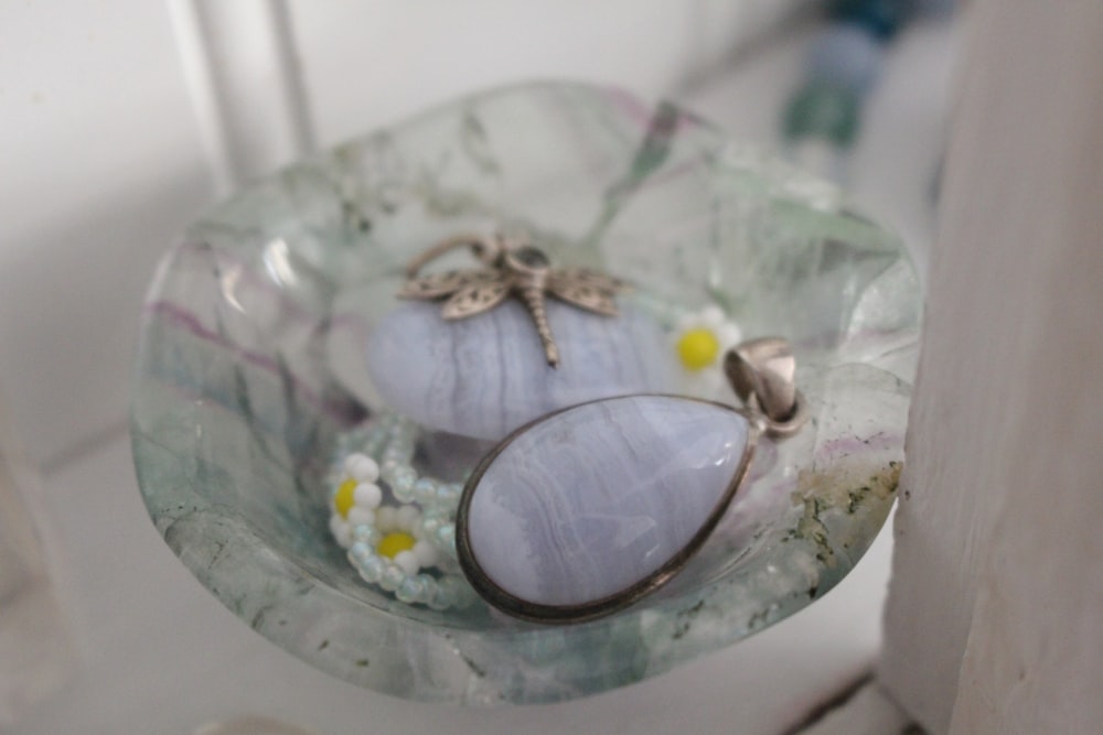 a glass plate with a glass decoration on it