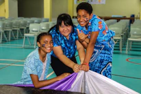 Children participating enthusiastically in a colorful school sports event.