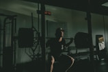 A person performing a perfect squat in a bright, airy home gym.