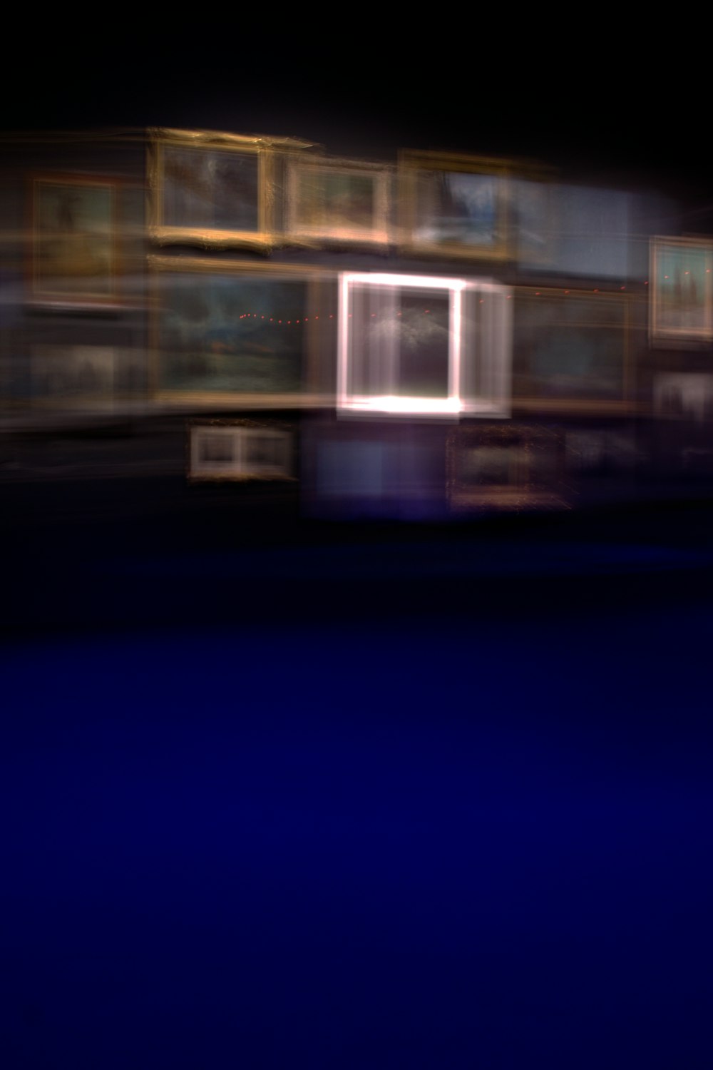 a blurry photo of a building at night