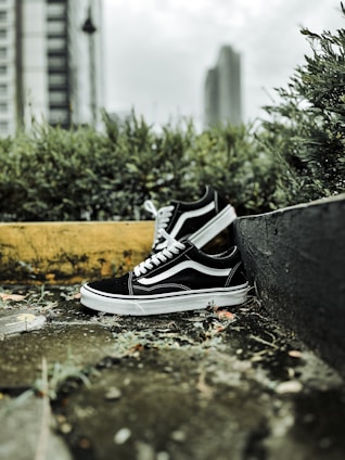 A close-up of stylish sneakers resting on a city sidewalk, capturing the essence of urban comfort.