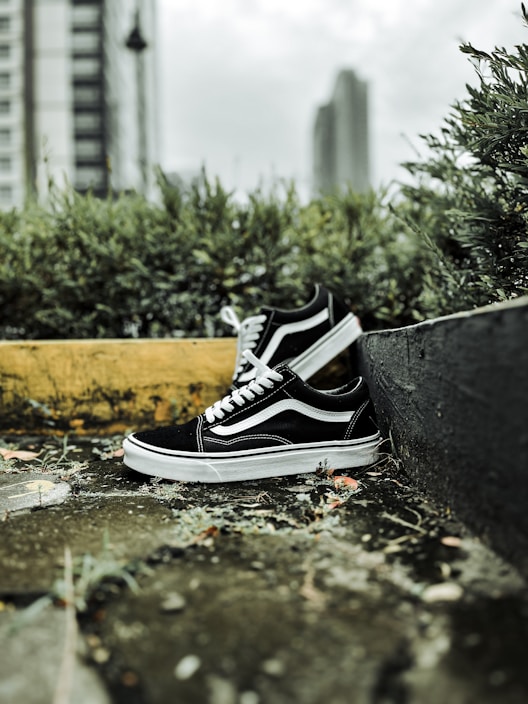 Close-up of trendy urban sneakers on a city sidewalk