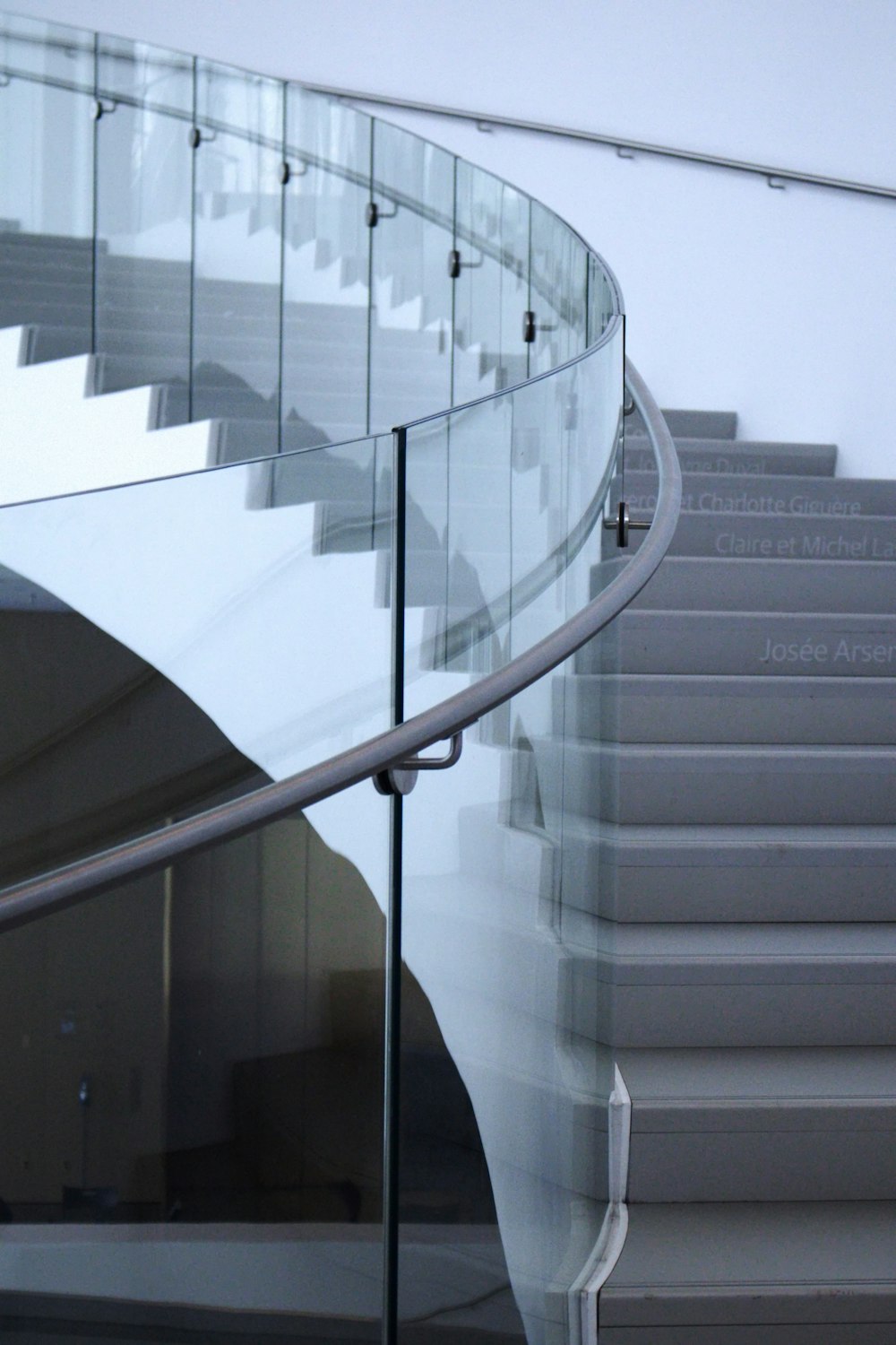 a close up of a glass stair case