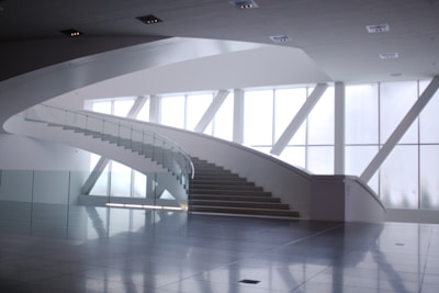 Shiny marble staircase inside a modern villa, reflecting natural light.