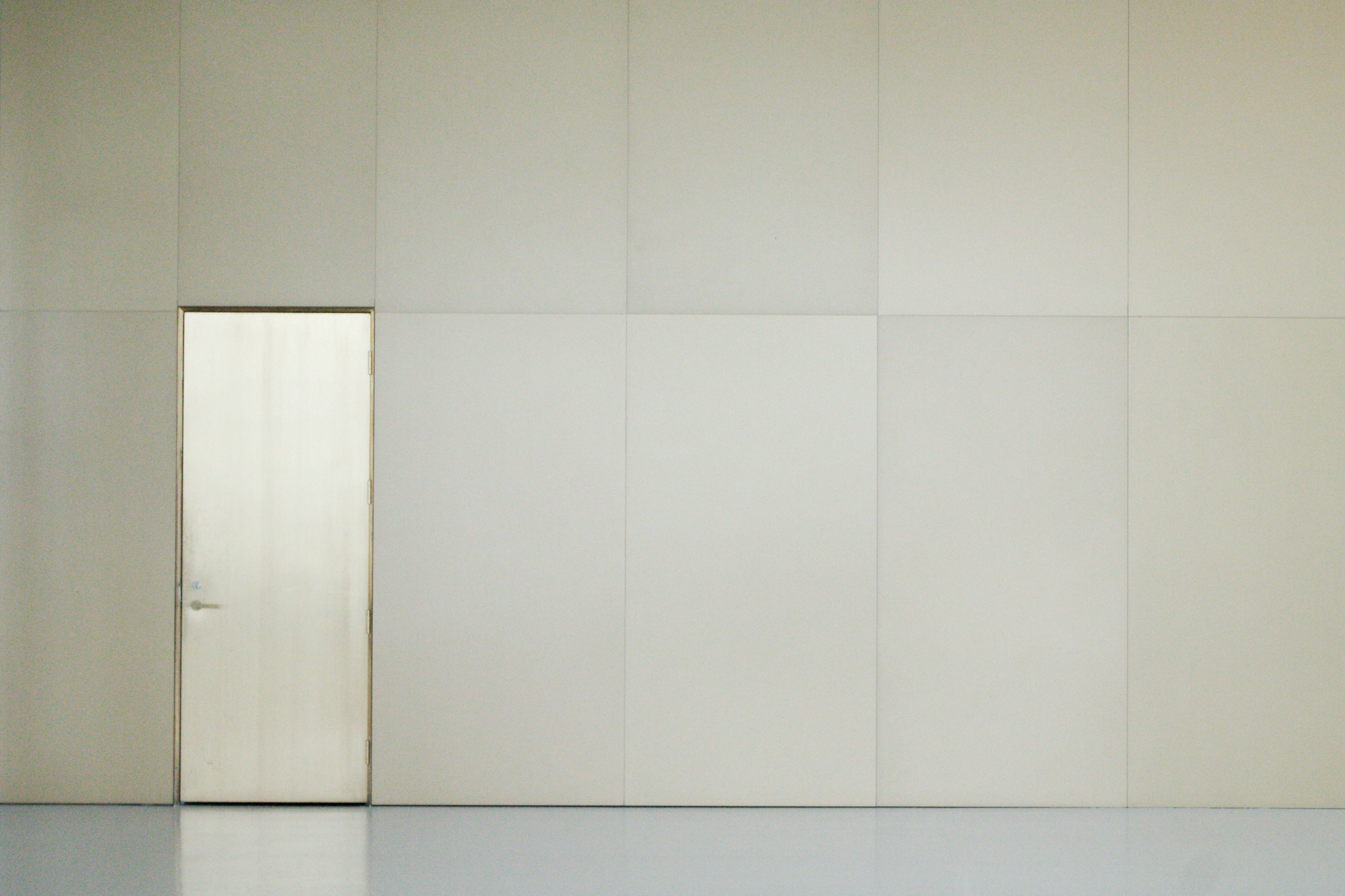 Image of a wall with floor-to-ceiling shelving, neatly organized - tiny apartment layout