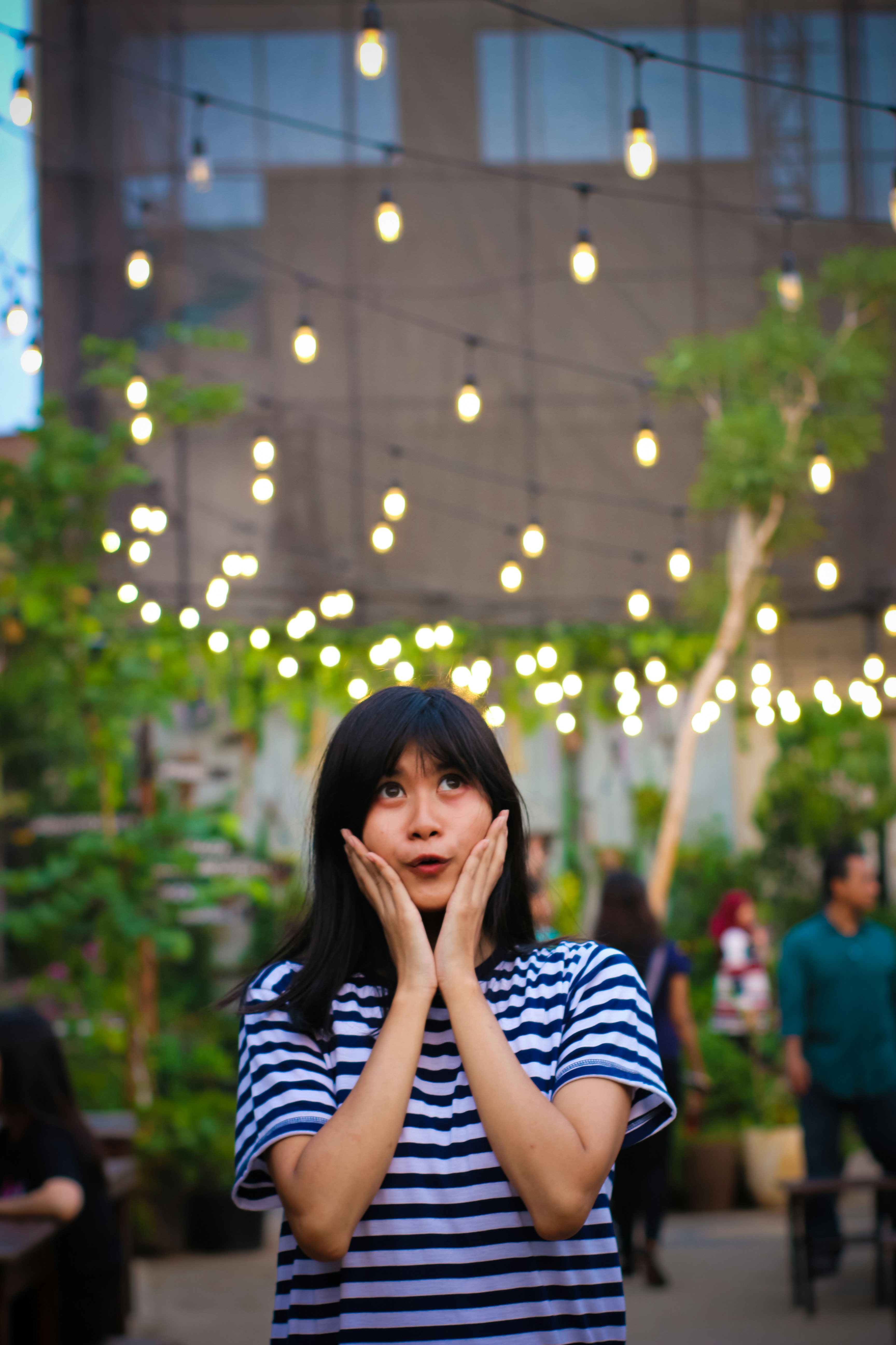 a woman covering her face with her hands