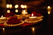 A romantic setting decorated for a wedding, with flowers and candles.
