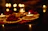 An elegant anniversary room decor featuring soft candlelight and floral arrangements.