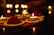 An elegant anniversary room decor featuring soft candlelight and floral arrangements.