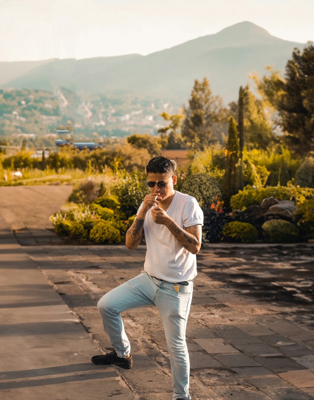 a man standing on a skateboard in a park