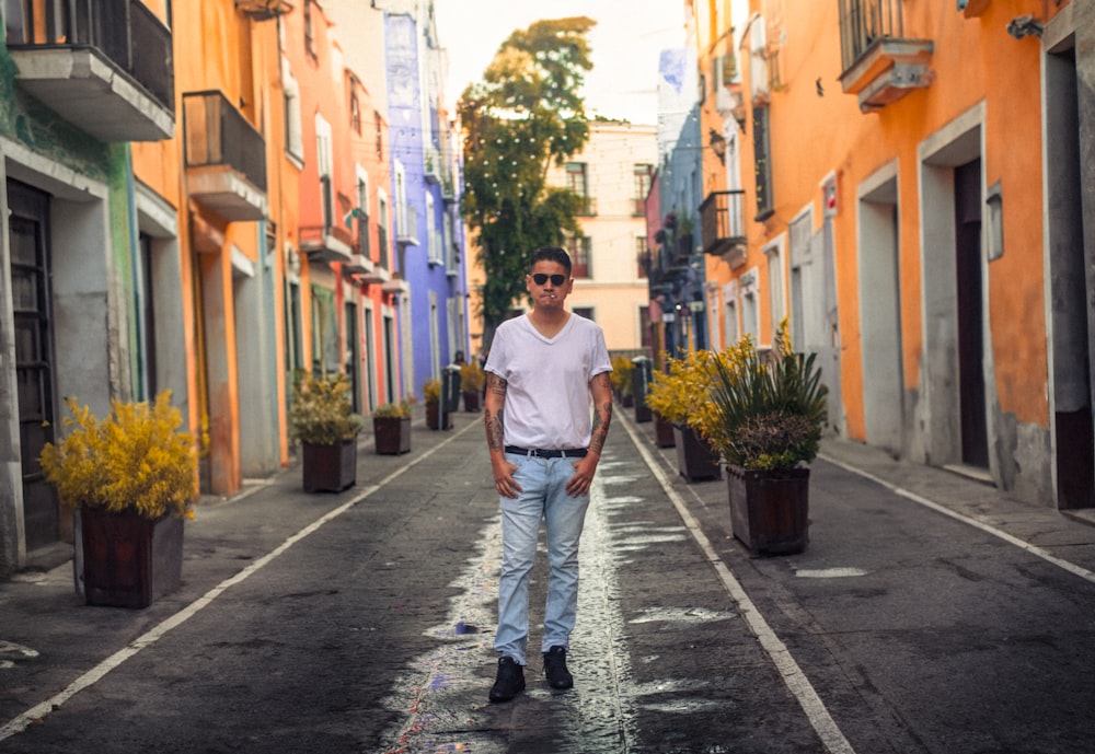 a man standing in the middle of a street