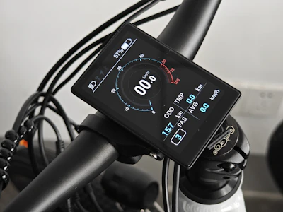 Close-up of the Kikos stationary bike's sleek digital display and sturdy pedals.
