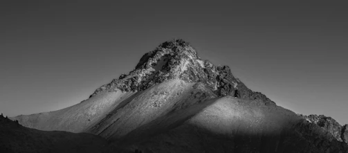 a black and white photo of a mountain