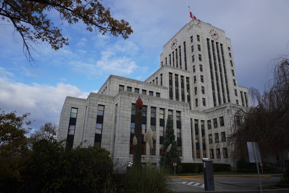 a large white building with a flag on top of it