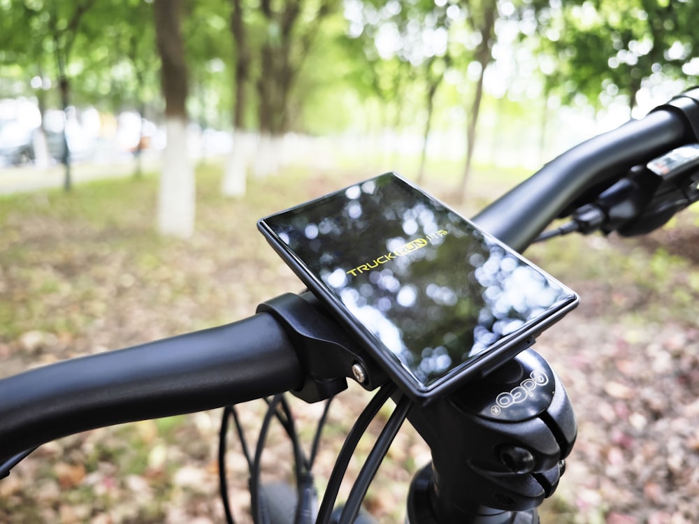 a tablet mounted on the handlebar of a bicycle