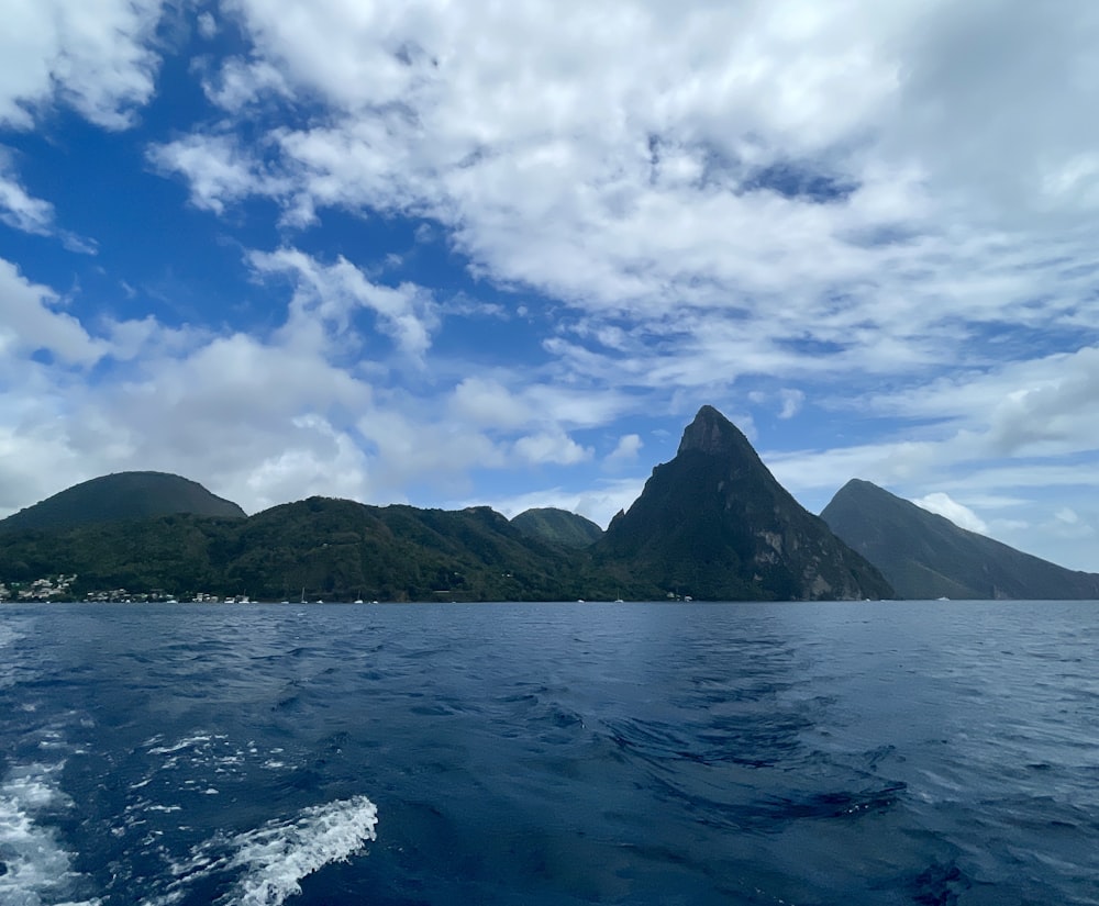 a view of the mountains from a boat on the water