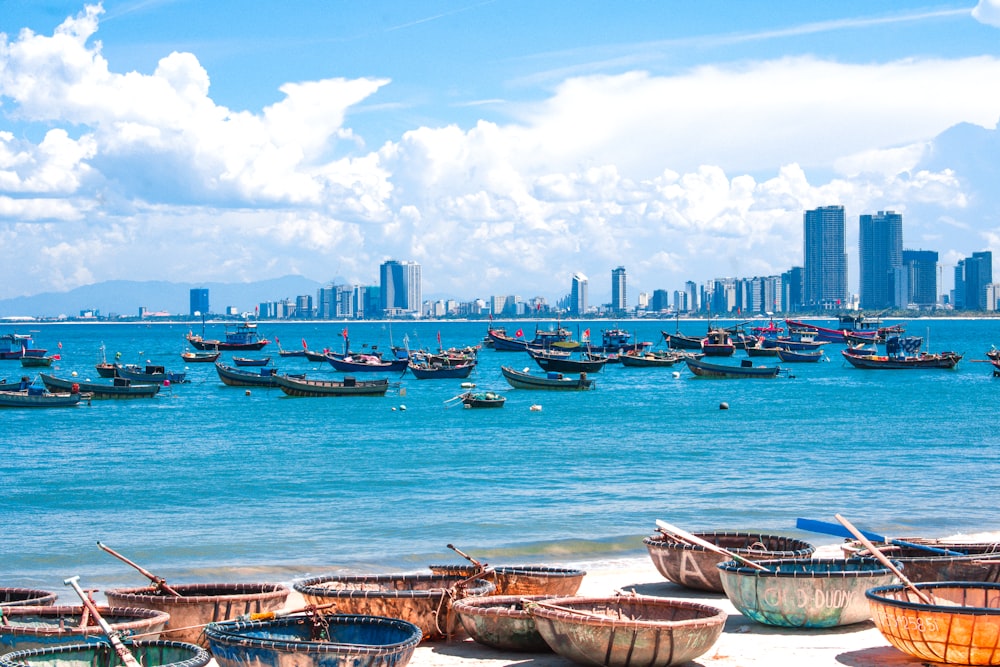 a group of boats floating on top of a body of water