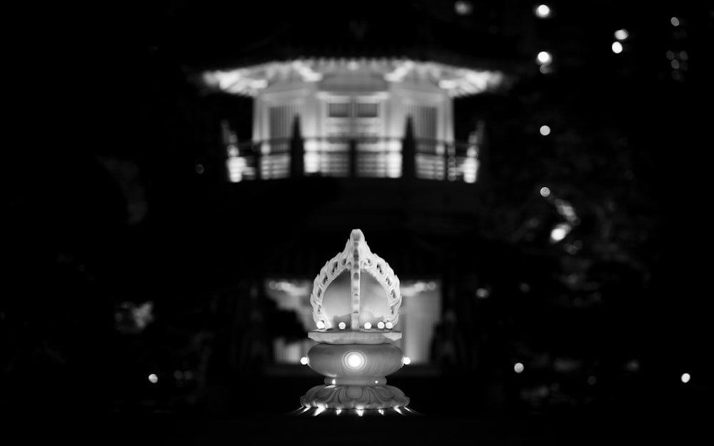 a black and white photo of a building at night