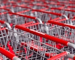 a row of red and silver shopping carts