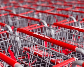 a row of red and silver shopping carts
